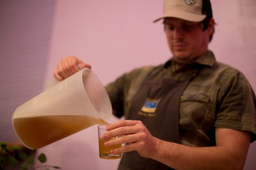 Paul taking his turn pouring beer
